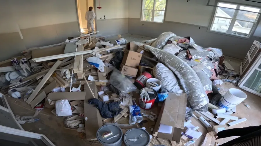 Garage piled with remodel debris before removal in Menifee, CA